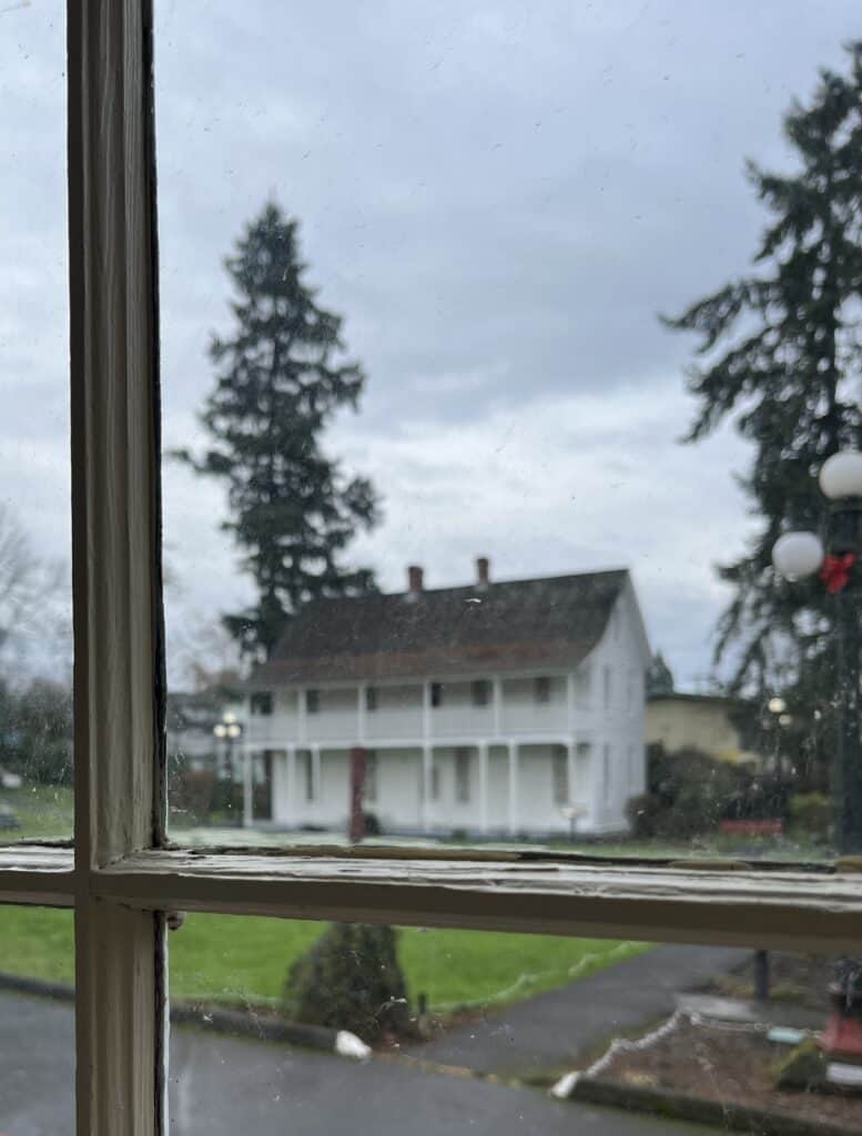 The old Lee Mission is framed within an old window in Salem, Oregon.