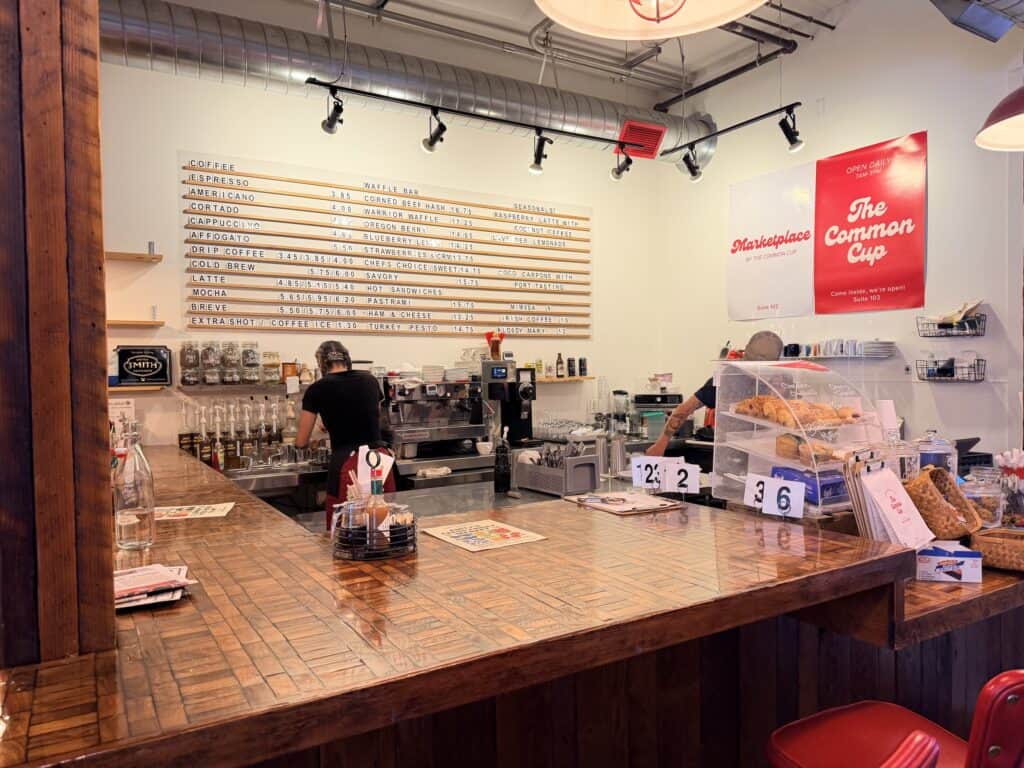Common Cup service area with menu on back wall.