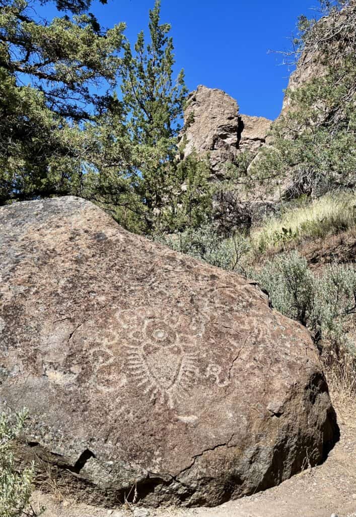 A complex petroglyph covers the face of a boulder at The Cove Palisades State Park, near Redmond, Oregon.