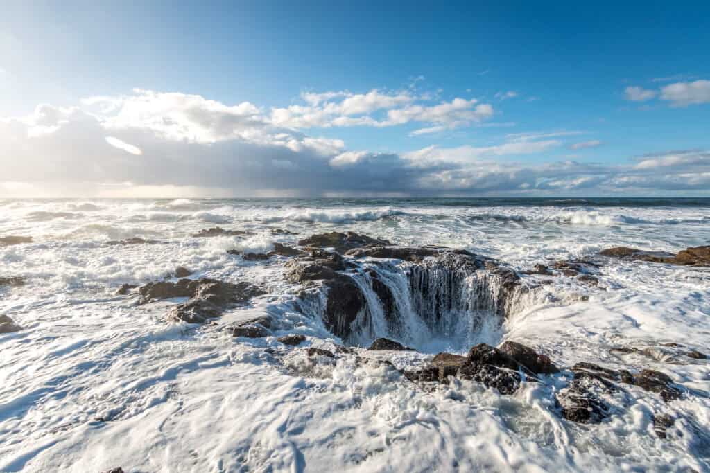 The ocean appears to drain away as tidewaters pour into Thor's Well.