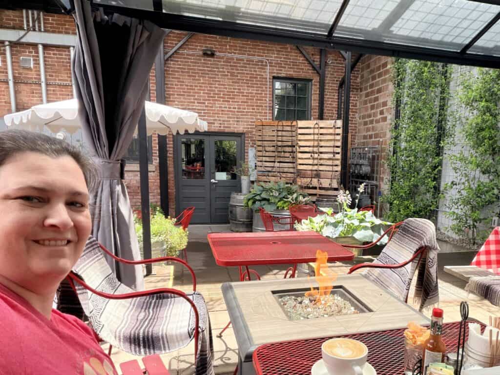 Jenn with the back patio behind.