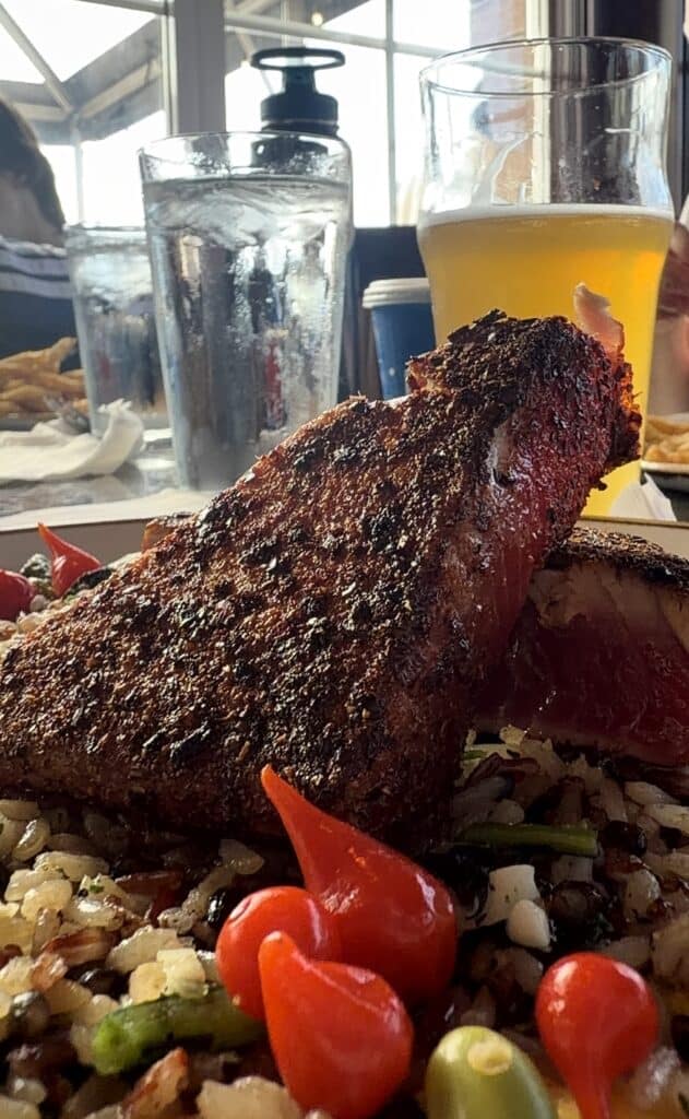 A beautiful Ahi Steak sits among rice and vegetables at the Pelican Brewery restaurant in Pacific City.