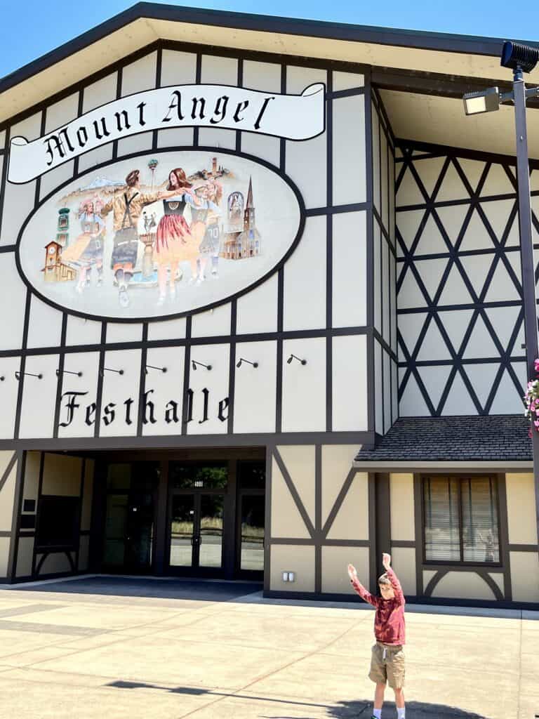 Our son in front of the Mt Angel Festhalle