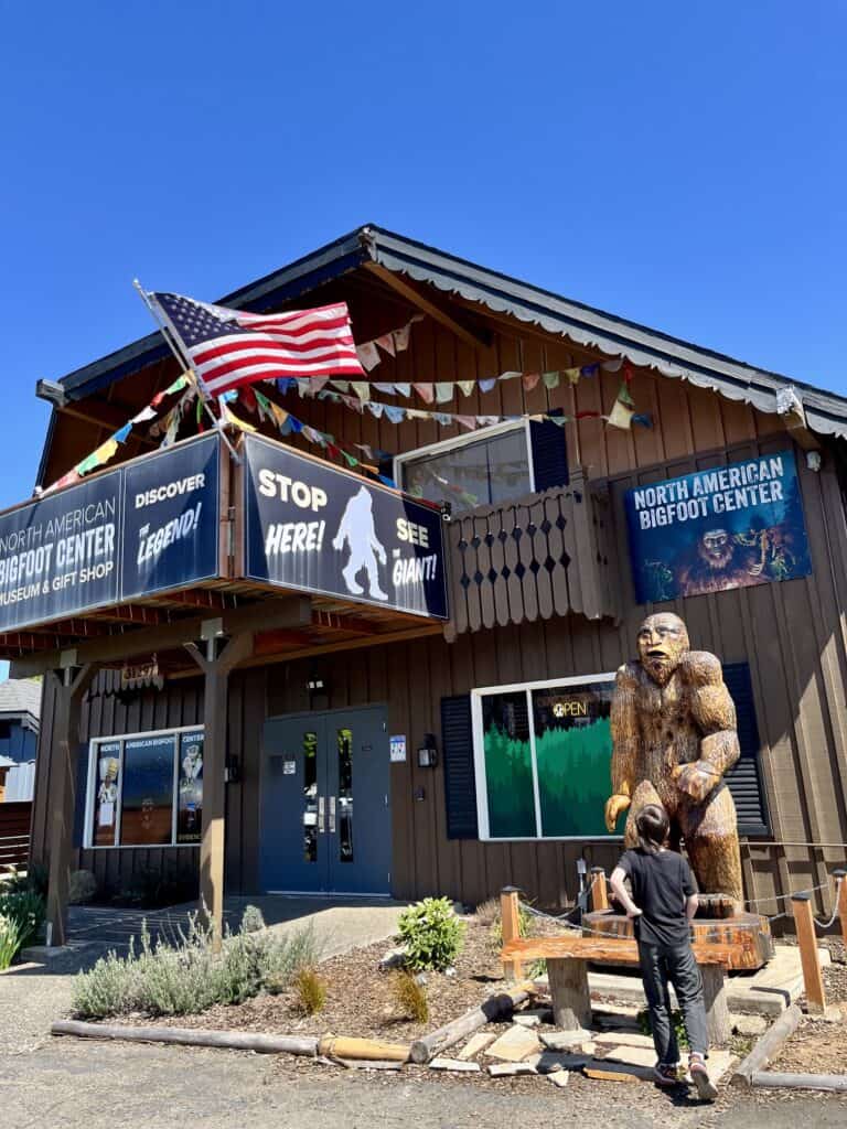 Boy standing outside The North American Bigfoot Center.