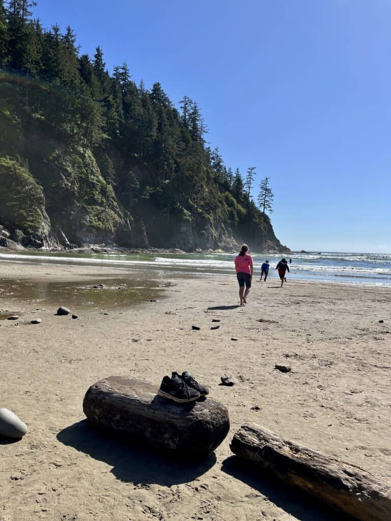 Tennis shoes sit abandoned on a piece of driftwood as our kids run toward the waves at Oswald West State Park.