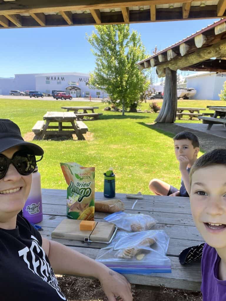 Jenn and boys enjoy a picnic lunch in front of the WAAAM.