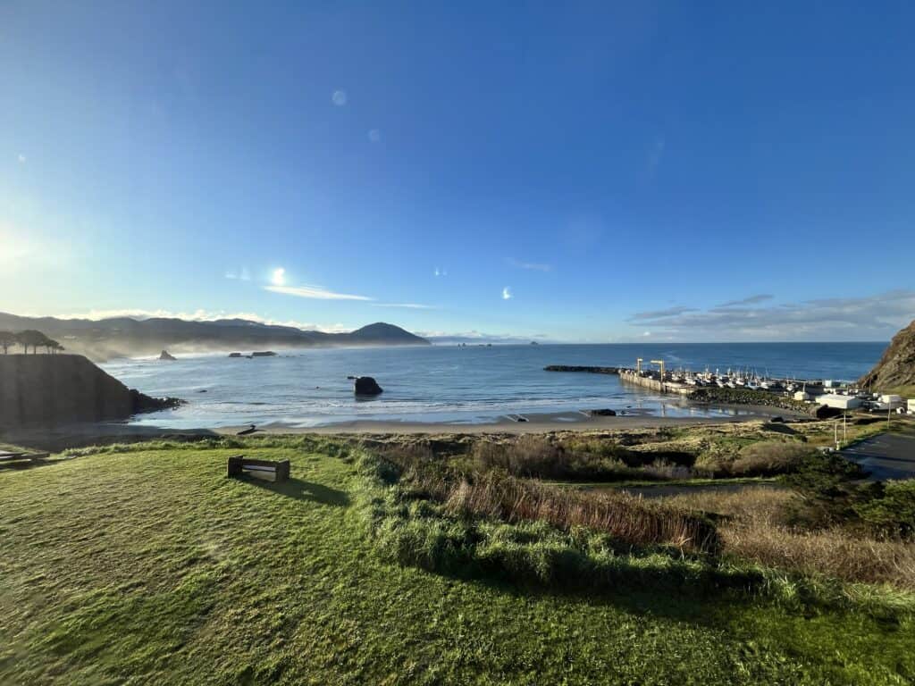 Waters are still on a sunny day at Port Orford Harbor.