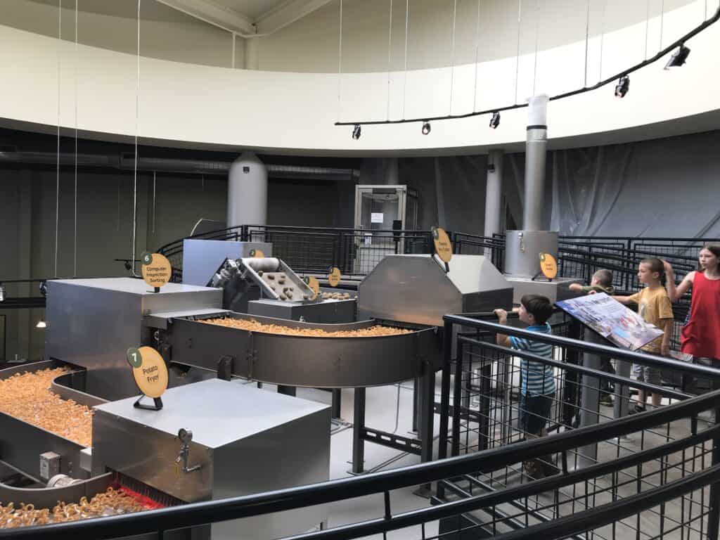 SAGE Center machinery showing the process of converting raw potatoes to potato chips.
