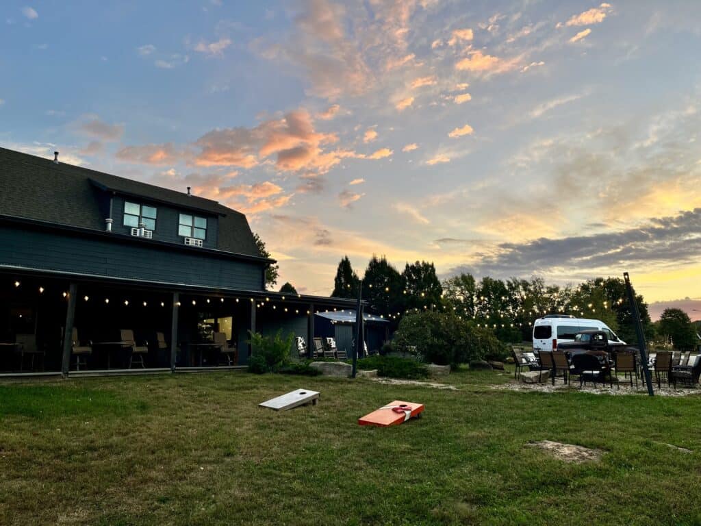 Circle S Ranch main building with the sunrise sky behind.