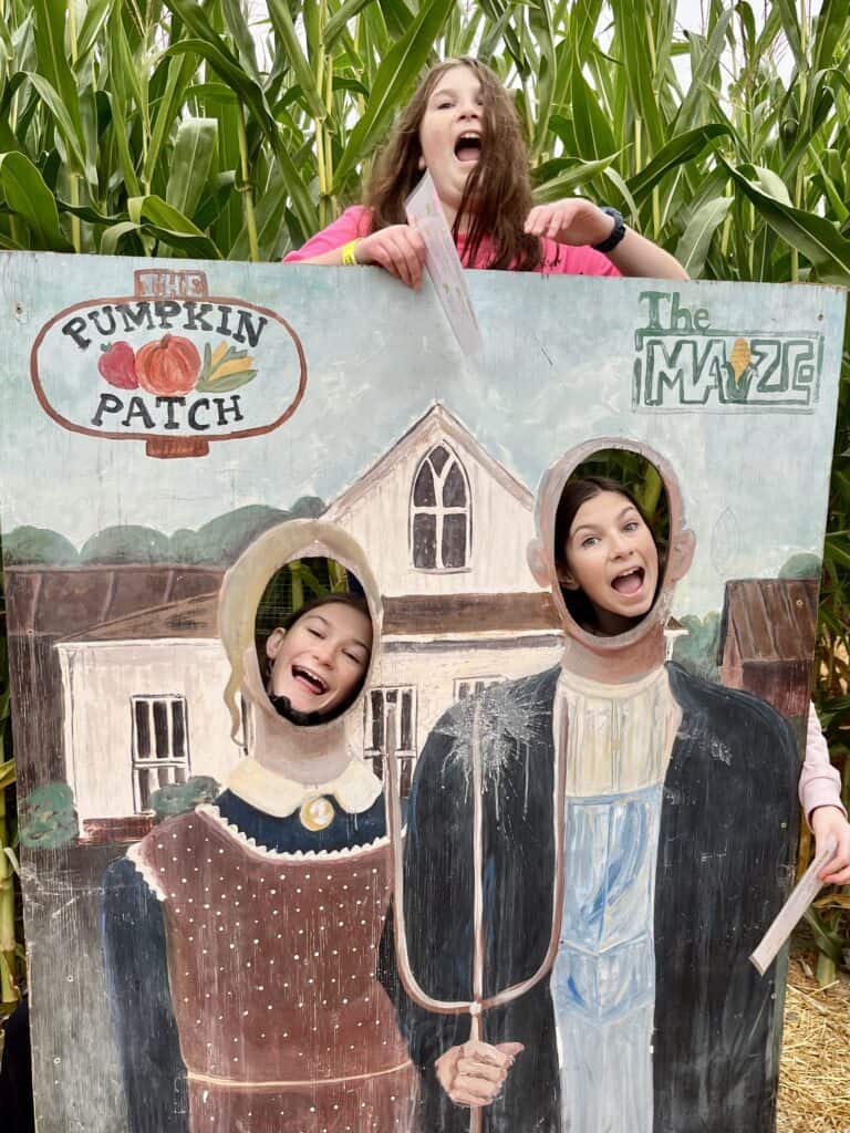 Our girls take a photo at the Pumpkin Patch photo op