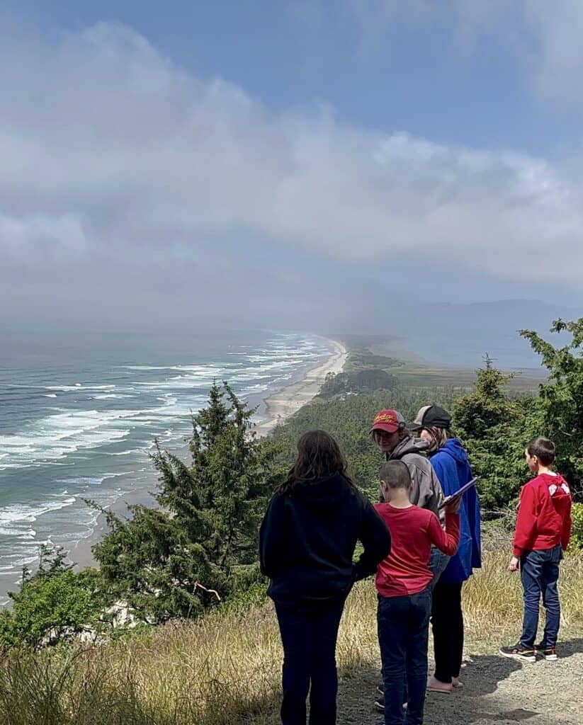 Our children look over a dramatic view of the Pacific Ocean and Tillamook Bay.