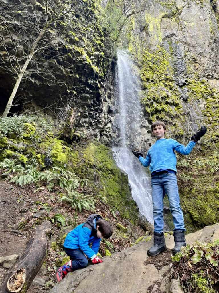 Our boys clamber over the rocks at Cabin Creek Falls.