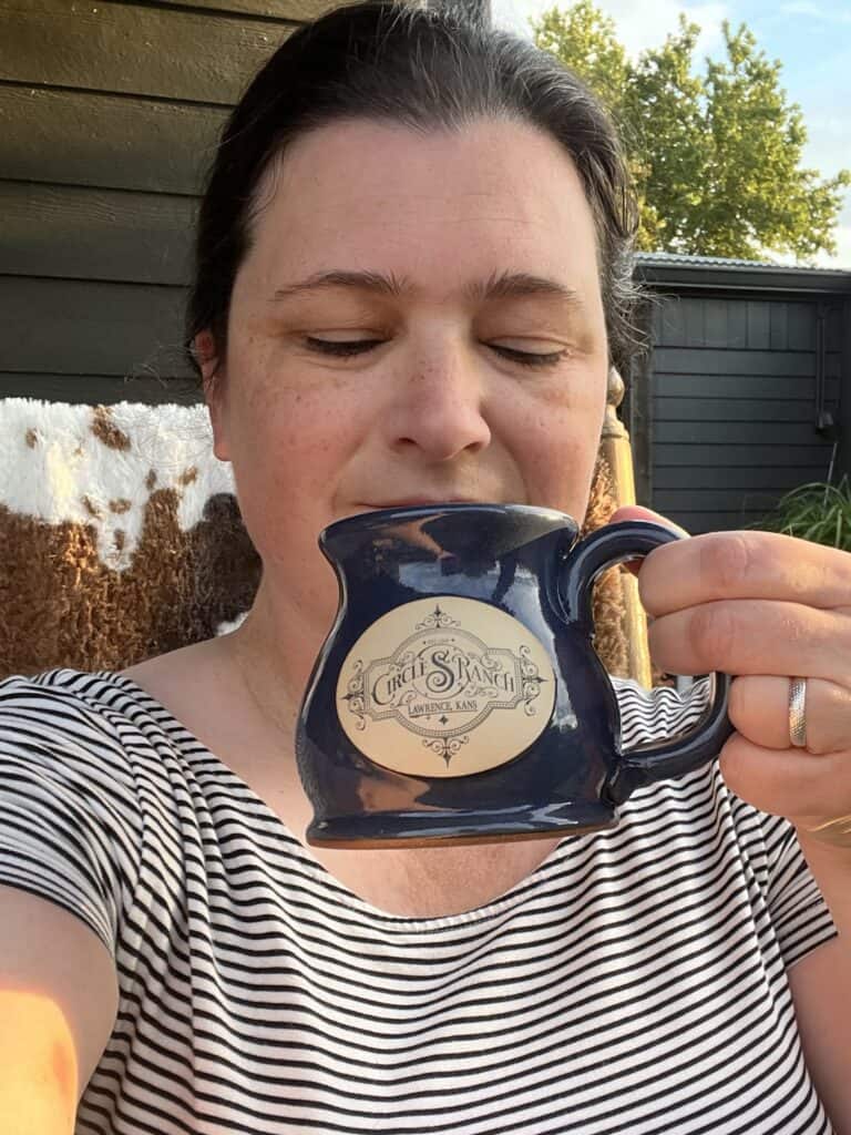 Jenn sips her coffee on the porch at Circle S Ranch.