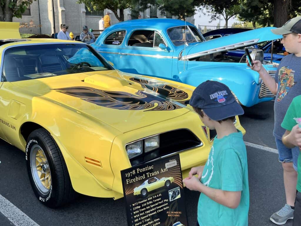 Our kids look at cars at the Mt Angel Car show at Oktoberfest.