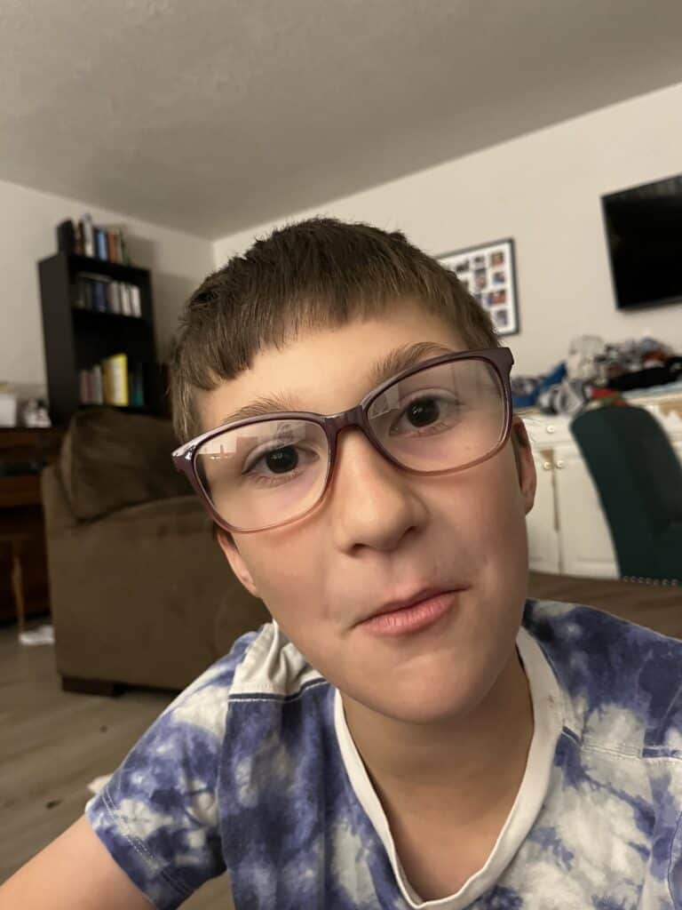 Our son tries on Dad's glasses.