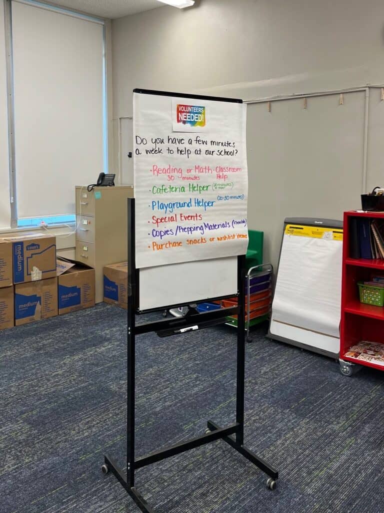 Sign asking for volunteers at a local school.