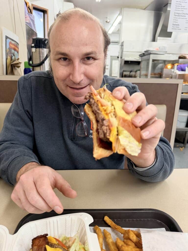 Brian enjoying a burger at Burger Time in Mt. Angel.