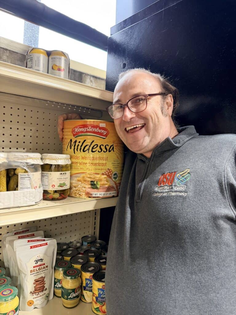 Brian next to a massive jar of sauerkraut.