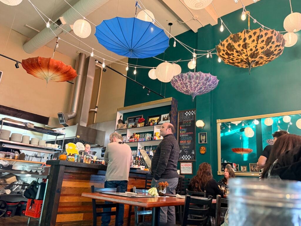 Colorful parasols hang from the ceiling at the Easy Otter