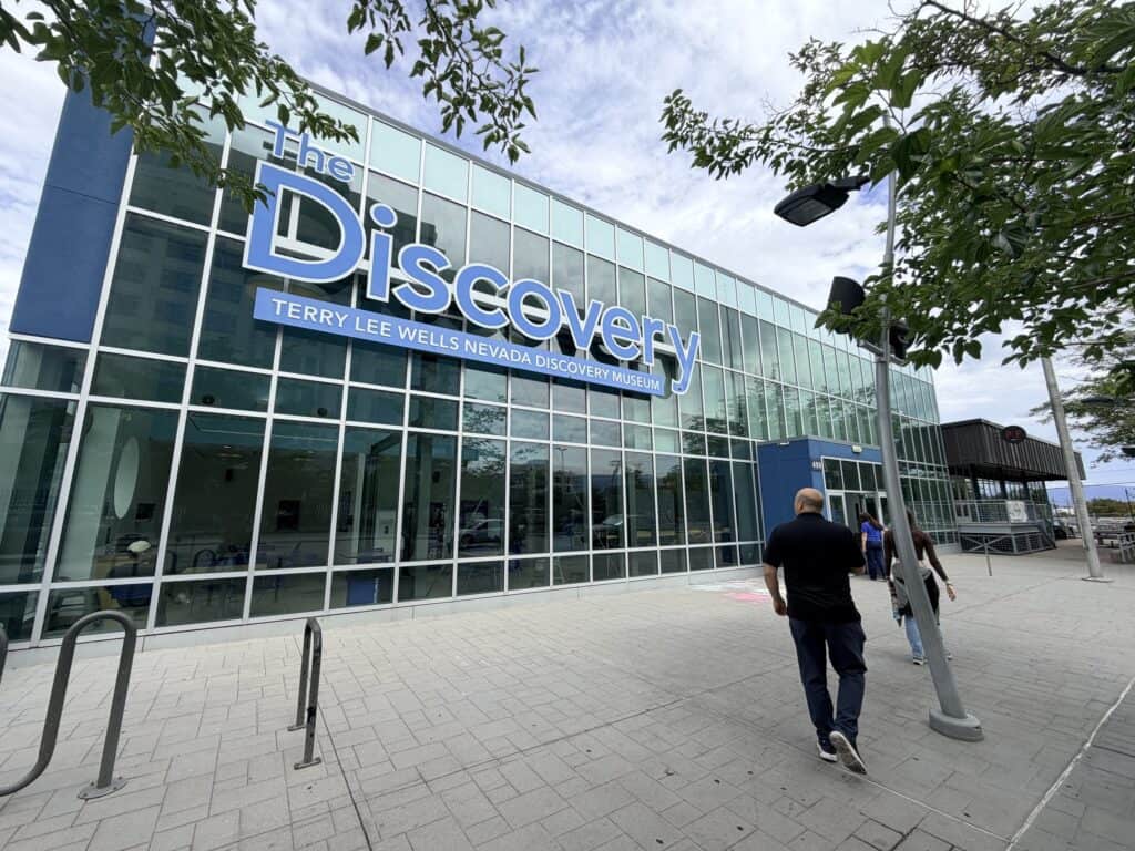 Brian walks towards the entrance of The Discovery.