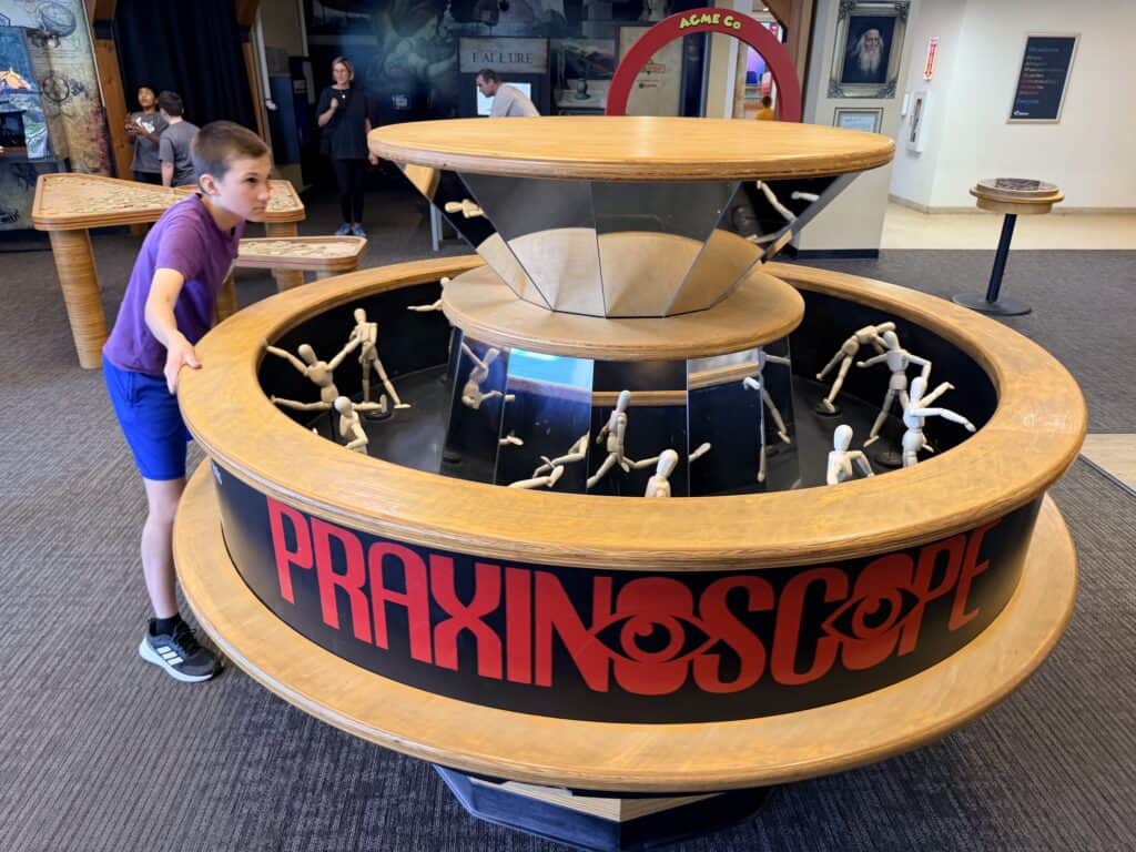 Our son uses the praxinoscope, a circular mirror model with figures that look like a movie.