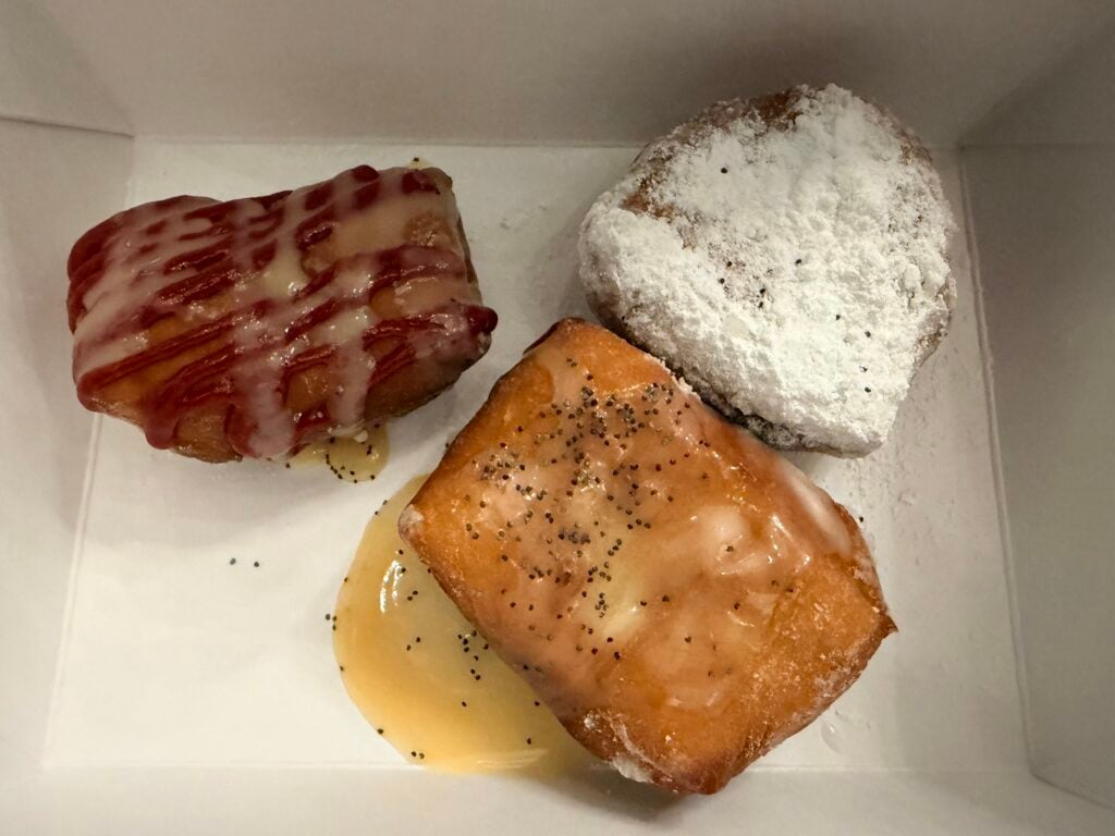 Plain beignet, Lemon poppy seed beignet and marionberry beignet.